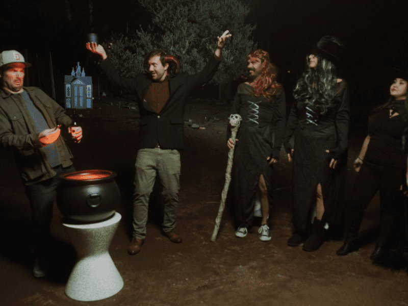 The Bibel Team Halloween Special 2021 Evil Mortgage team standing in the dark outside around a cauldron