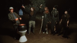 The Bibel Team Halloween Special 2021 Evil Mortgage team standing in the dark outside around a cauldron